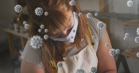 Woman in Pottery Studio Wearing Mask with COVID-19 Virus Overlay - Download Free Stock Images Pikwizard.com