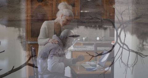 Mature couple collaborating in cozy home workspace