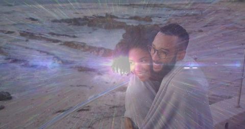 Romantic Couple Cuddling at Twilight with Magical Light Rays