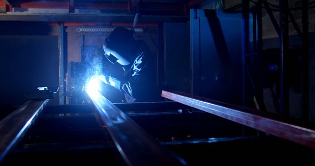 Industrial Worker Welding Metal in Factory at Night - Download Free Stock Images Pikwizard.com