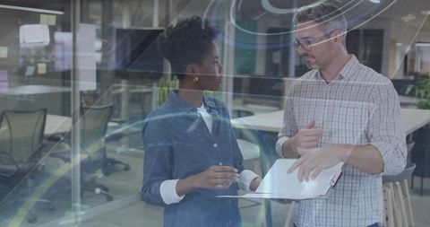 Business Professionals Discussing Analytics with Digital Interface Overlay