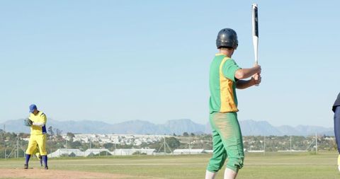 Batter Preparing to Swing with Pitcher Delivering and Fielder Positioning on Sunny Baseball Field