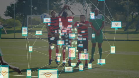 Soccer Players Engaged in Data and Technology Analysis