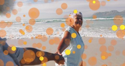 Walking hand in hand on beach with vibrant overlays