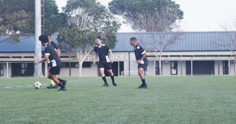 Young Soccer Players Busy in Practice Session on Outdoor Field