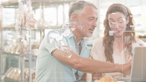 Mature Couple Analyzing Financial Data on Laptop