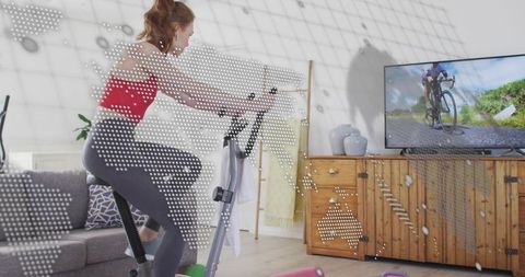 Connected Home Cycling Workout Woman Training on Stationary Bike with TV Overlay