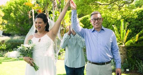 Joyful Senior Couple Celebrating Wedding Ceremony in Garden