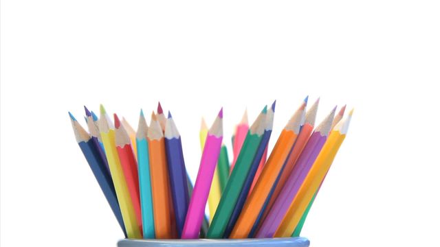 Brightly colored pencils in a holder fully designed with various colors against a white background. This video can be used for back-to-school advertisements, art supply promotions, educational content, stationery catalogs, creative projects moments depiction or websites.