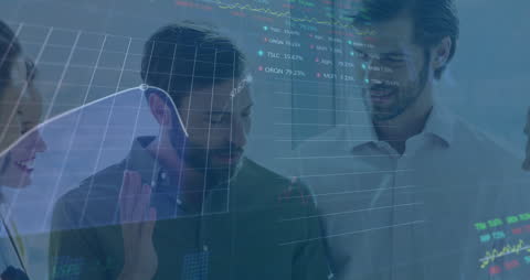Business Team Analyzing Stock Market Data with Graph Overlays