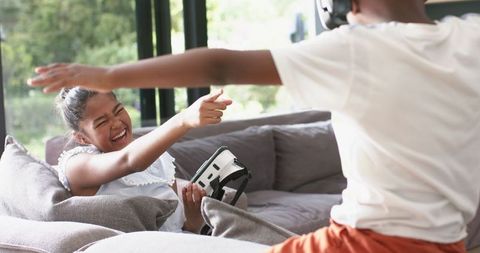 Joyful Kids Exploring Virtual Reality in Living Room