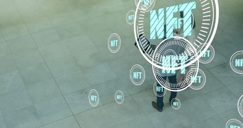 Walking business professionals in atrium displaying nft holographic interface overlay