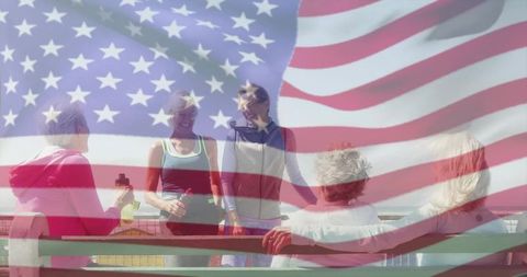 Women gathering on waterfront bench with american flag overlay
