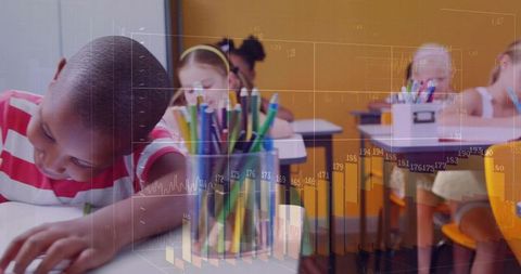 Young student leaning and writing at desk with colorful pencils and data graphs overlay