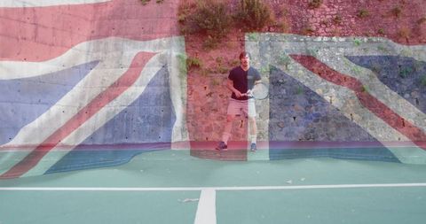 Man with tennis racket on outdoor stone wall court