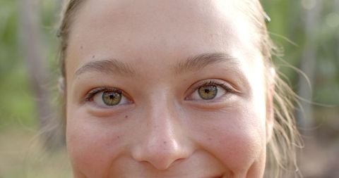 Close-Up of Young Woman with Fresh Smile Outdoors