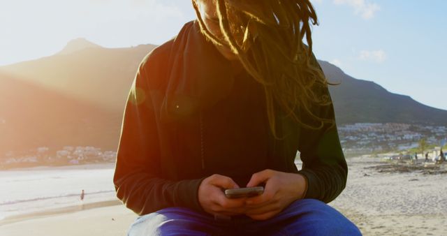 Man with Dreadlocks Using Smartphone at Beach - Download Free Stock Images Pikwizard.com