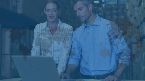 Team Analyzing Data on Laptop in Warehouse with Global Map Overlay