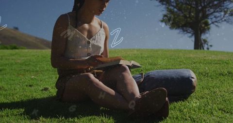 Woman Reading Book Outdoors with Floating Alphabets - Download Free Stock Images Pikwizard.com