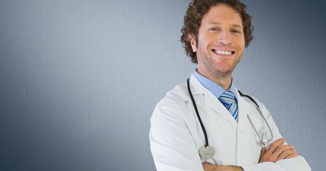 Smiling doctor with his arms crossed against grey background - Download Free Stock Photos Pikwizard.com