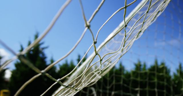 Close-up of net against blue sky on sunny day - Download Free Stock Images Pikwizard.com