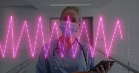 Female Doctor Using Tablet with Heart Monitor Graphic