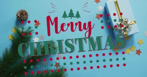 Merry christmas typography on blue flatlay with gift box, pine sprig, pinecone, confetti