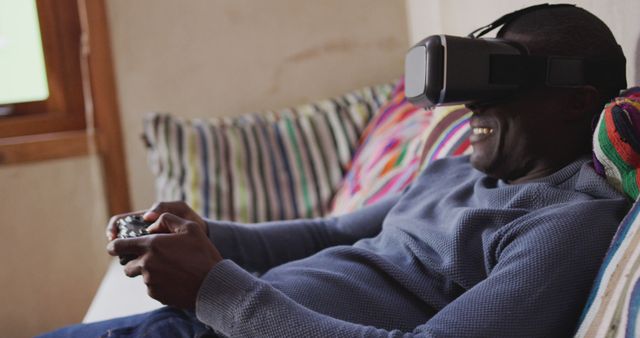 Man Enjoying Virtual Reality Gaming on Couch at Home - Download Free Stock Images Pikwizard.com