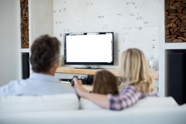 Family Watching TV in Rustic Living Room with Transparent TV Screen - Download Free Stock Videos Pikwizard.com