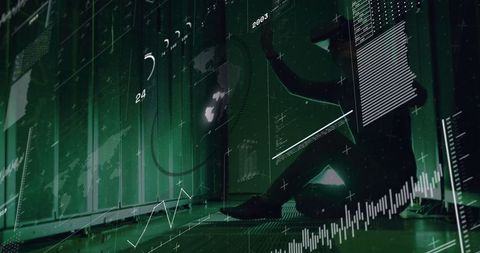 Silhouetted man analyzing holographic data in advanced green digital center