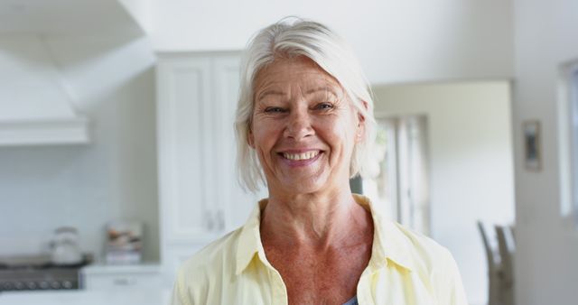 Happy Senior Woman Smiling in Bright Modern Kitchen - Download Free Stock Images Pikwizard.com