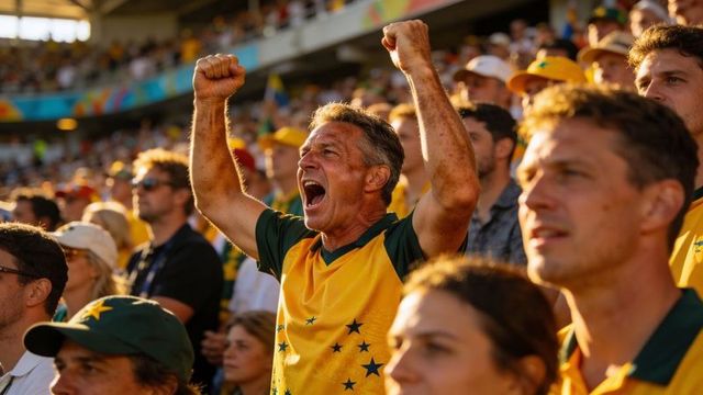 Energetic fan cheering and raising fists in sunlit stadium wearing yellow-green jerseys