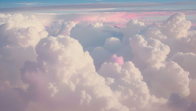 Serene Pastel Pink and White Cumulus Clouds High Above
