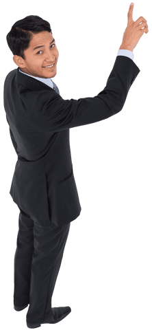 Confident businessman pointing upwards transparent background