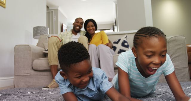 Happy African American Family Relaxing at Home and Playing with Children - Download Free Stock Images Pikwizard.com