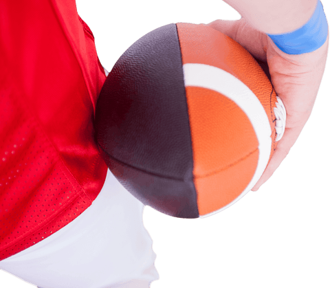 American football player holding ball in game action pose transparent
