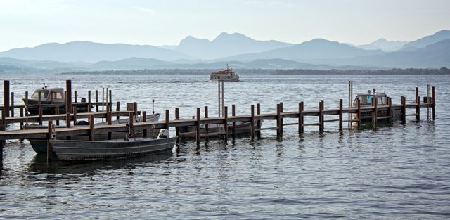 Peaceful Lake Scene with Dock and Mountains in Background - Download Free Stock Images Pikwizard.com