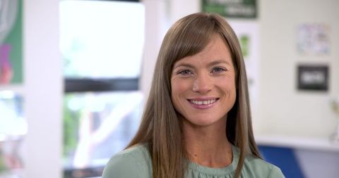 Professional Woman Smiling in Modern Office Reception