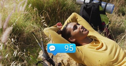 Serene Rest During Hiking Adventure in Grassy Hillside