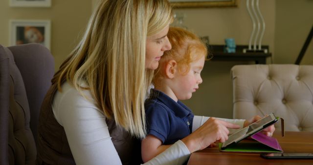 Mother Teaching Daughter Using Tablet at Home - Download Free Stock Images Pikwizard.com