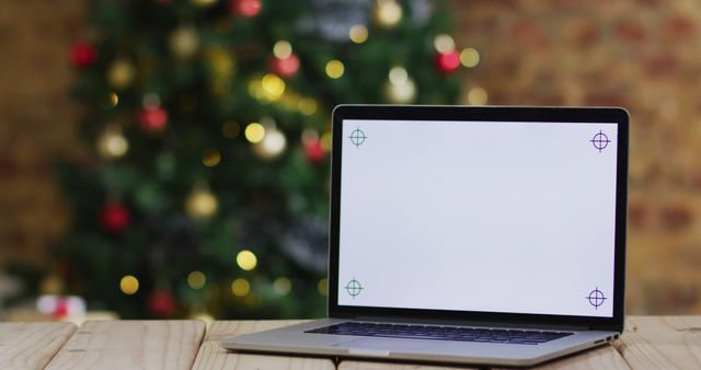 Blank Laptop Screen with Christmas Tree in Background - Download Free Stock Images Pikwizard.com