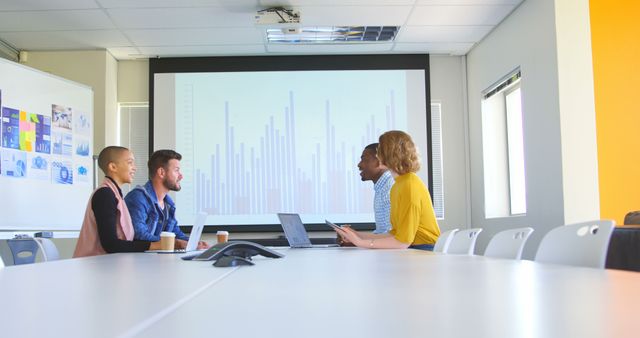 Diverse Colleagues Discussing Data in Modern Meeting Room - Download Free Stock Images Pikwizard.com