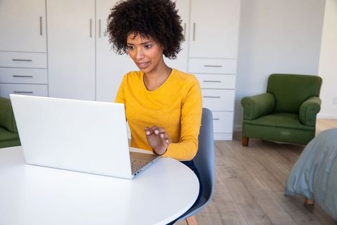 Focused African American Woman Working on Laptop at Home Office