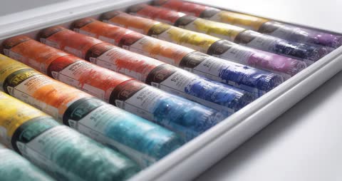 Colorful Paint Tubes Reflecting Creative Possibilities in Artist's Studio