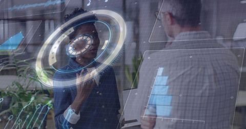 Collaborating team visualizing holographic interface with circular HUD and analytics