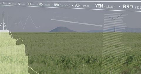Wind turbine in grasslands with currency data overlay