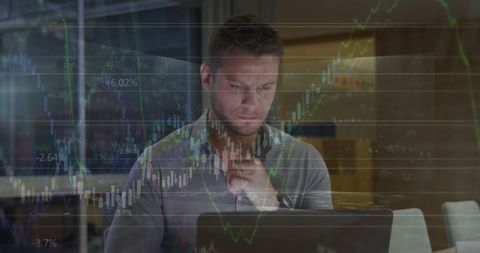 Caucasian Businessman Analyzing Financial Data on Laptop in Office - Download Free Stock Images Pikwizard.com