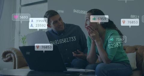 Couple managing finances using technology with digital metrics overlay