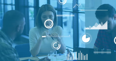 Diverse Team Analyzing Financial Data with Digital Interfaces