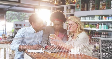 Diverse Coworkers Innovating Together in Modern Café
